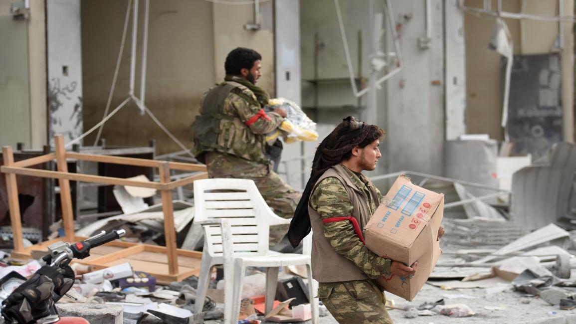 عمليات نهب في عفرين السورية (بولنت كيليك/فرانس برس)