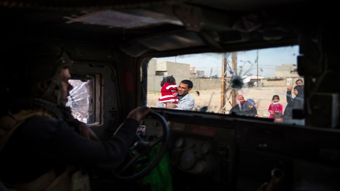العراق-مجتمع- مدنيون في الموصل (أود أندرسون/فرانس برس)