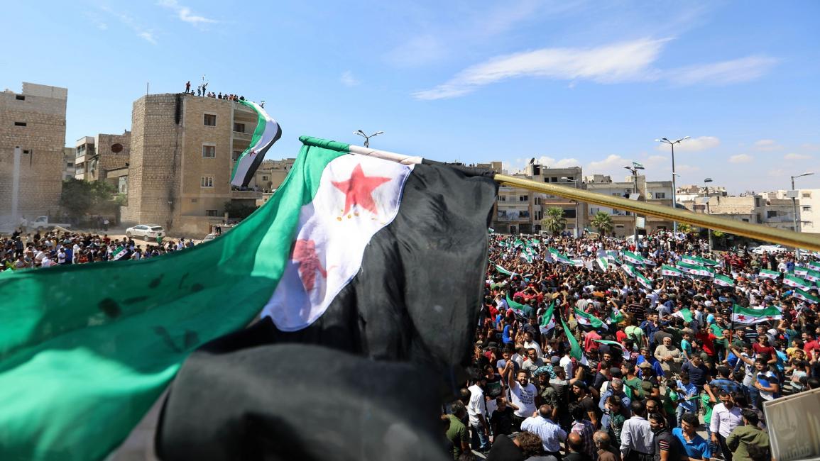 مظاهرة في إدلب (عمر حج قدور/فرانس برس)