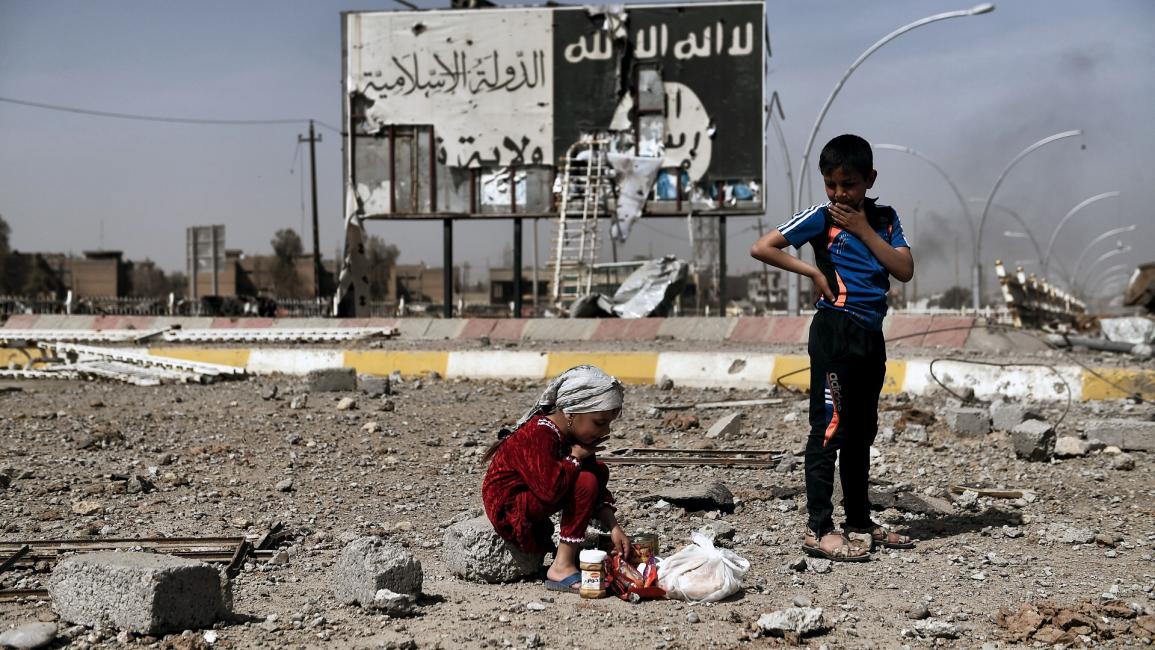أطفال عراقيون في منطقة محررة من العراق - مجتمع