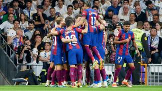 Getty-The players of of FC Barcelona celebrate after scoring a...