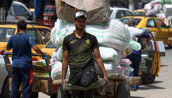 أسواق العراق عمال العراق (فرانس برس)