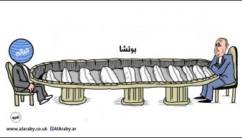 كاريكاتير طاولة بوتين / عبيد 