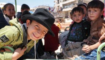 أطفال سوريون في إدلب في عيد الأضحى (عمر حاج قدور/ فرانس برس)
