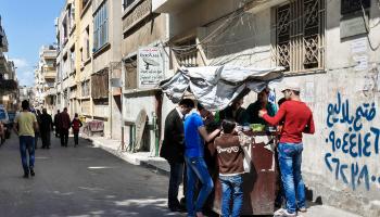 تتعاون العصابات مع أجهزة النظام في حمص (فرانس برس)