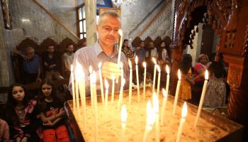 أحد الشعانين في كنيسة القديس برفيريوس الأرثوذكسية في مدينة غزة 4 - 28 إبريل 2024 (داوود أبو الكاس/ الأناضول)