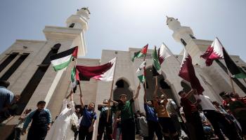 أعلام قطر وفلسطين في غزة/سعيد خطيب ــ فرانس برس