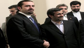 سعد الحريري وأحمدي نجاد (فرانس برس)