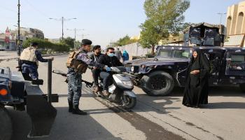 الشرطة العراقية/كورونا-سياسة-أحمد الرباعي/فرانس برس