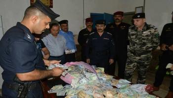 الشرطة العراقية تضبط أموالا بغرفة متسولة متوفاة(وزارة الداخلية العراقية)