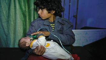 ضحايا الهجوم بغاز السارين بسورية(حسن محمد/AFP)