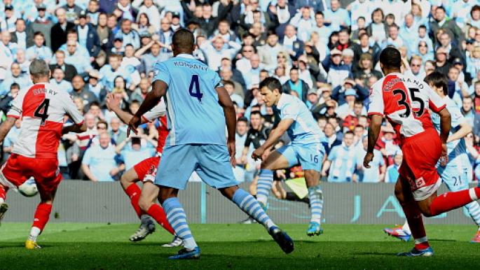Manchester City's Argentinian striker Sergio Aguero (3rd R) scores their late winning goal during the English Premier League football match between Manchester City and Queens Park Rangers at The Etihad stadium in Manchester, north-west England on May 13, 2012. Manchester City won the game 3-2 to secure their first title since 1968. This is the first time that the Premier league title has been decided on goal-difference, Manchester City and Manchester United both finishing on 89 points. AFP PHOTO/PAUL ELLIS 