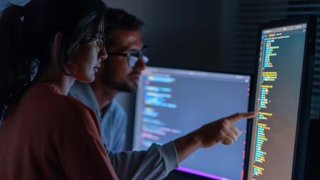 Getty-Computer, Female programmer and male training for coding, cyber secu
